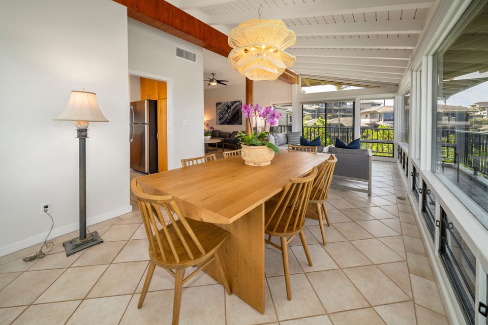 Bright dining space with tropical views and open-concept design.