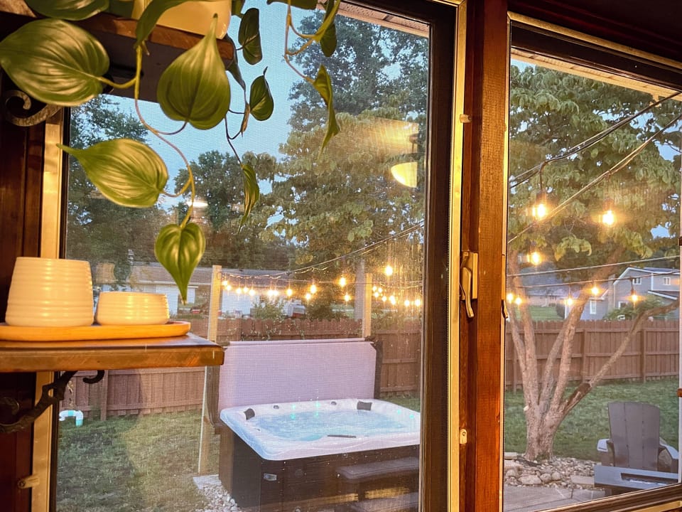 Enjoy a peek at the bubbling hot tub from the kitchen window ✨ while you prepare drinks or rinse up after a backyard evening.