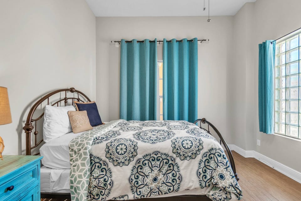 Queen bed in guest bedroom