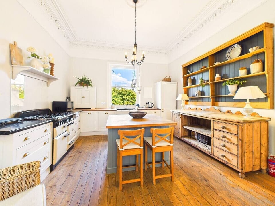 Cook up a feast on the range in the main kitchen, with an island to gather round and a dresser full of country charm.