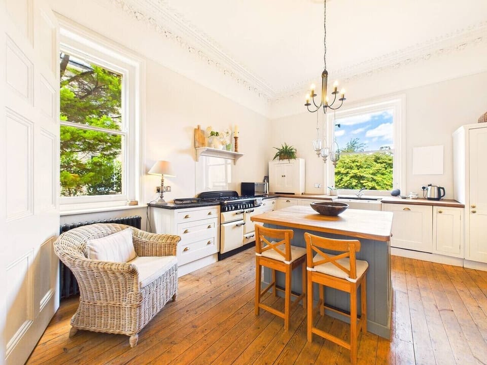Linger over breakfast at the kitchen table, with garden greenery filling every window.
