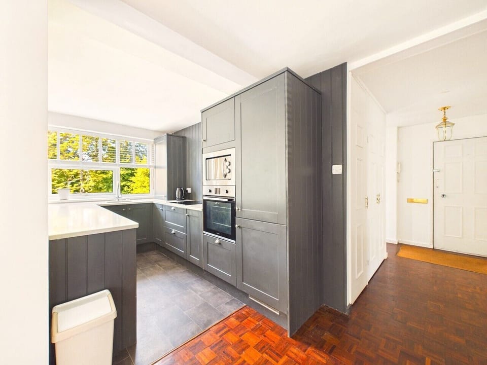 The smart grey kitchen is fully equipped with oven, microwave and a peninsula worktop, so you can cook properly even on holiday.