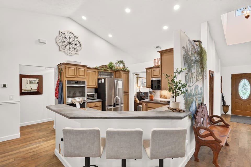 The kitchen is fully stocked with all you need to prepare meals.  The kitchen features a double wall oven, glass cooktop, stainless steel fridge with ice and filtered water, a large sink, built in microwave and a toaster oven.