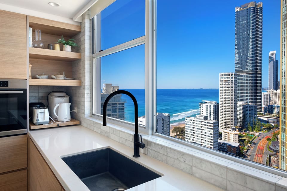 Even the kitchen comes with a view, looking south across Surfers Paradise.