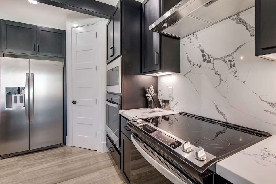Stylish kitchen with modern appliances, generous counter space, and elegant finishes.