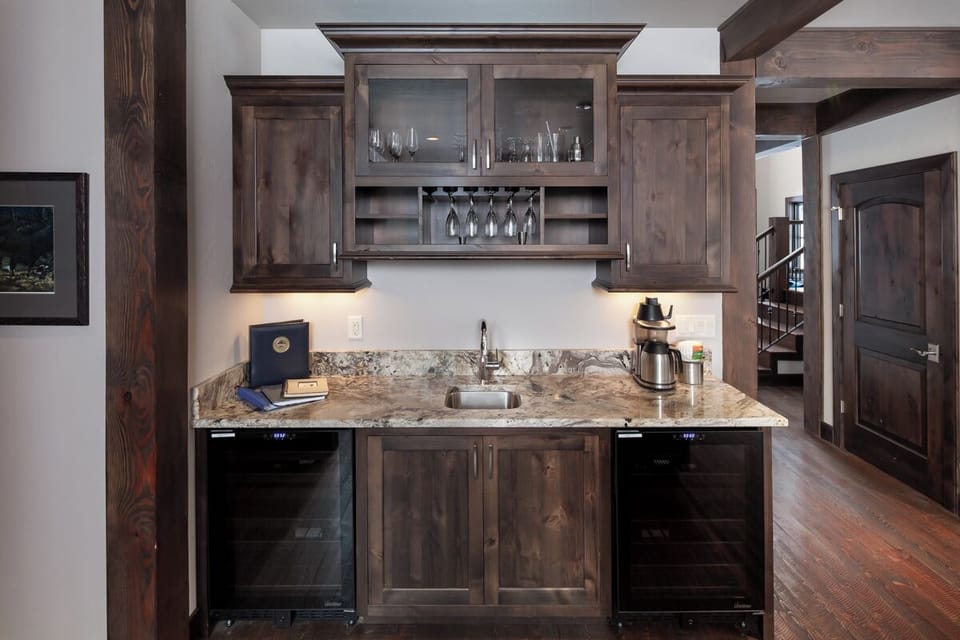 Sip evening wine at the built-in bar with glass storage.