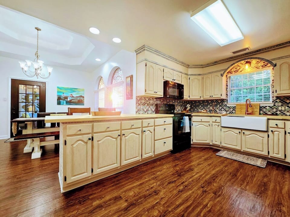 Relish in the custom everything in this delightful, fully loaded, kitchen! From the butcher block counter tops to cabinet trim and HUGE farmhouse sink, every apsect of this kitchen has been crafted for your cooking and gathering experience.
