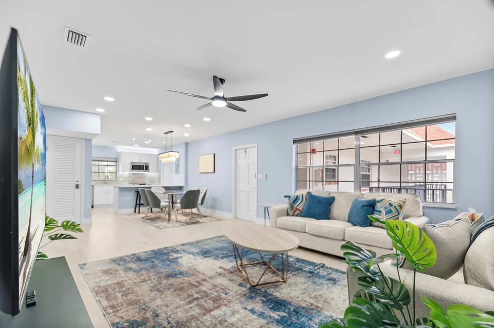 Spacious living room with comfortable seating and a Smart TV.