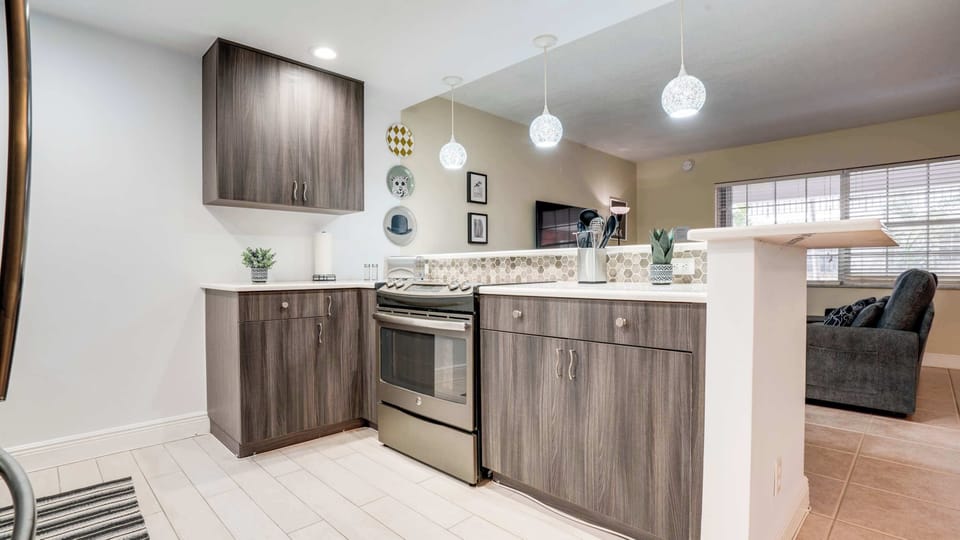 Fully equipped kitchen with modern appliances, cookware, and essentials.