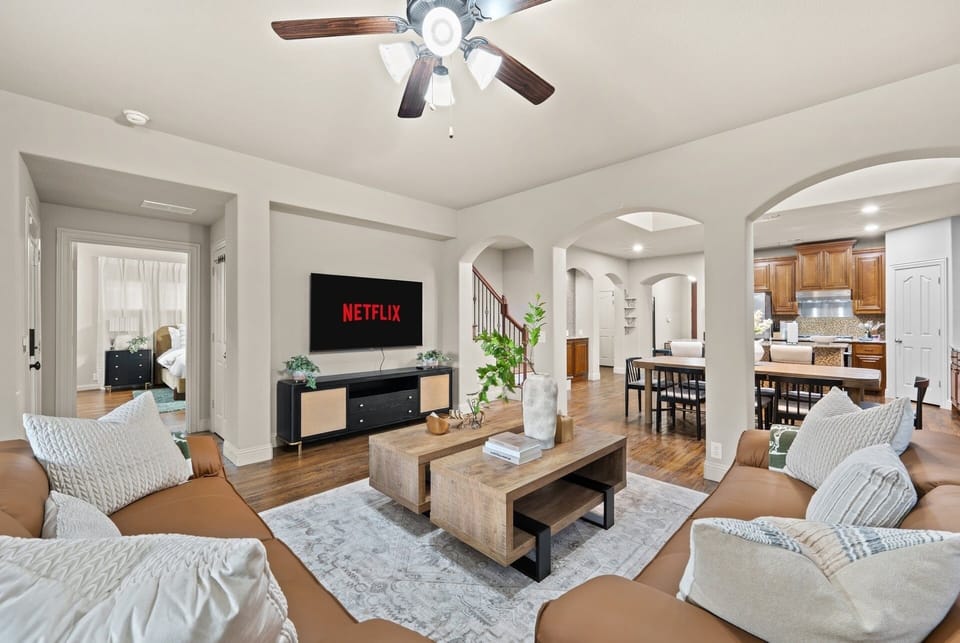 Kick back on the sofa for a movie night with the whole group, with the open living space flowing right into the kitchen and dining area.