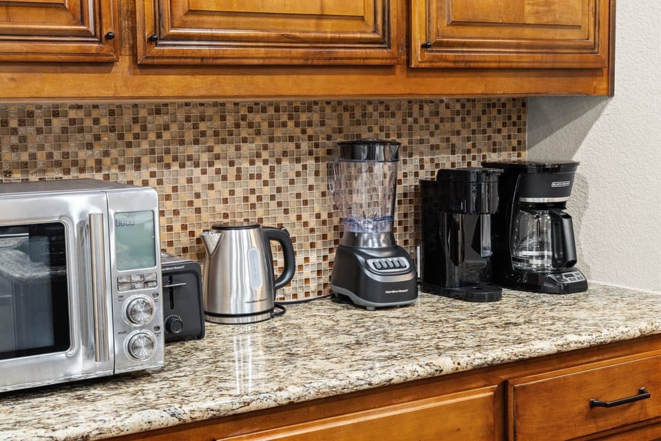 Brew your morning coffee and get the day going with the microwave, kettle, toaster, blender, and coffee makers all ready to use.