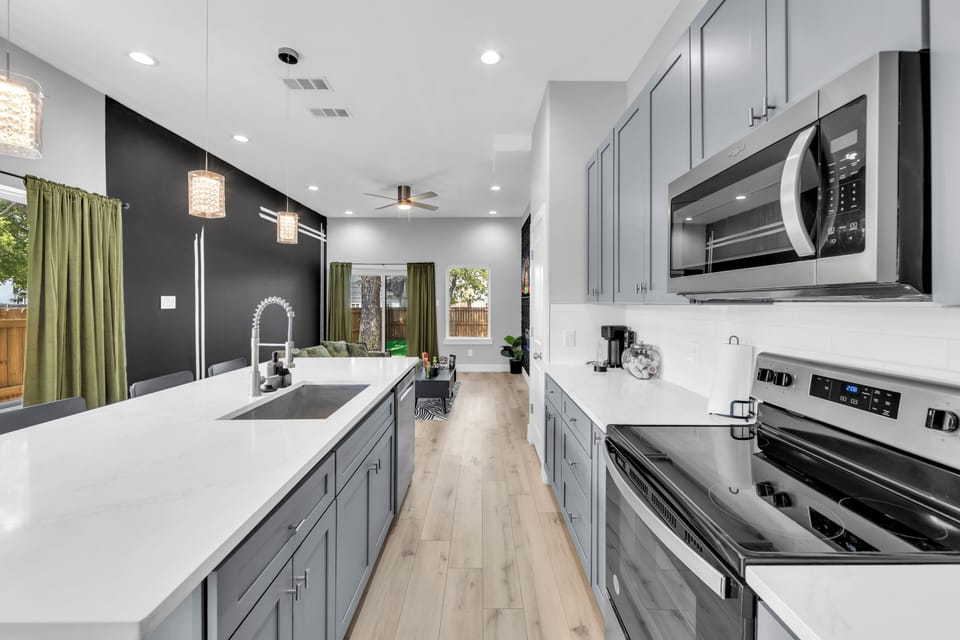 Bright modern kitchen with quartz island and open-concept layout