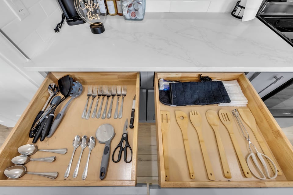 Organized modern kitchen drawers with coffee bar convenience