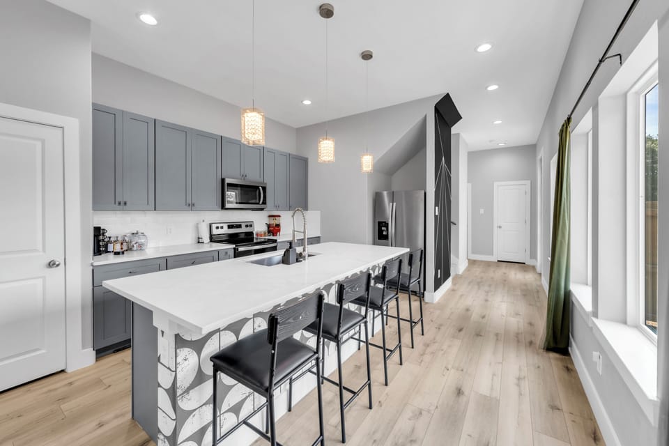 Bright modern kitchen with large island seating and stylish finishes