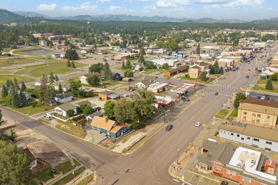 An aerial view showcasing the home’s prime location in the heart of Custer, with downtown restaurants, shops, and local conveniences just minutes away.