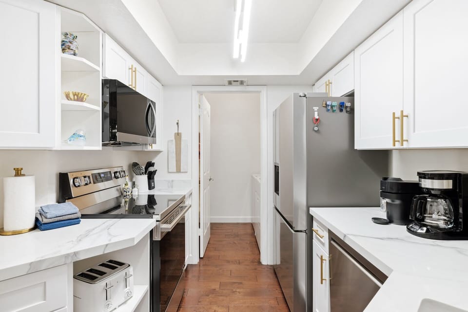 Bright modern kitchen with stainless appliances and sleek finishes