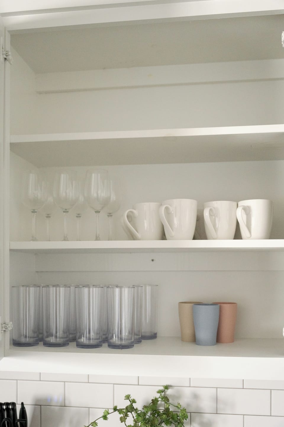 Organized modern kitchen drawer with fully stocked silverware