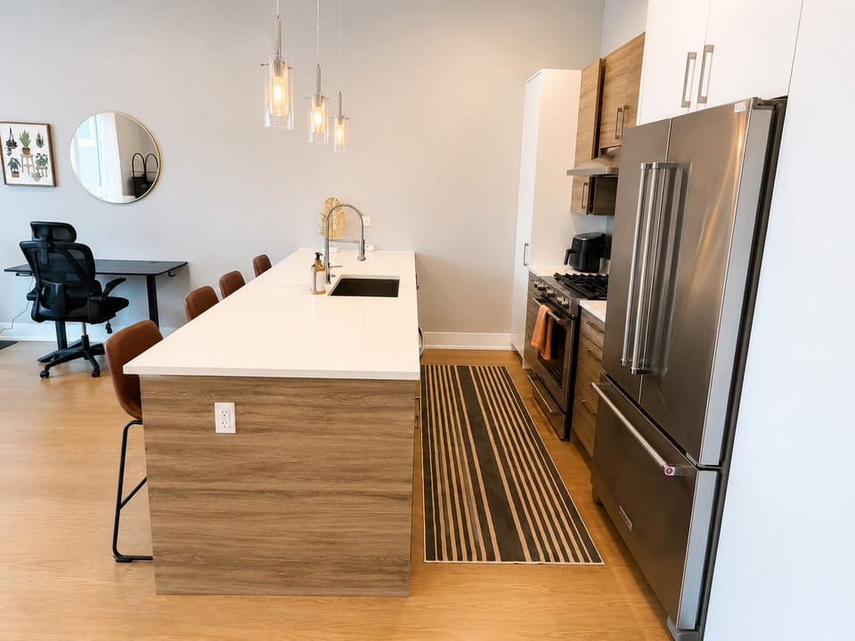Bright modern kitchen with large island seating and dedicated workspace