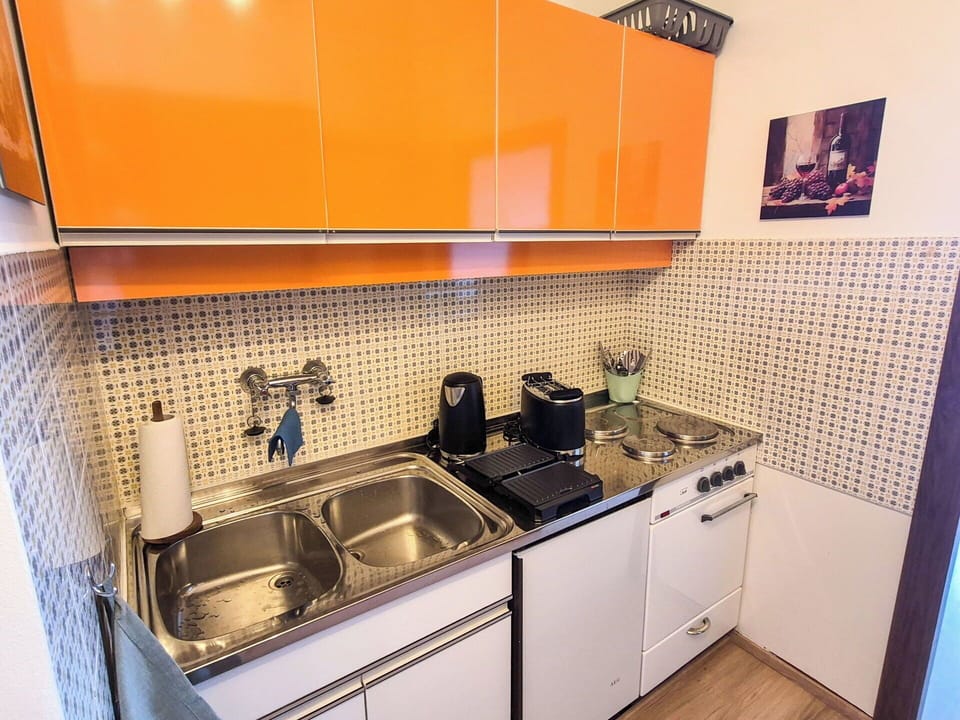 Kitchen, Kitchen Appliance, Countertop, Major Appliance, Kitchen Sink, Cabinetry, Interior Design, Sink, Plumbing Fixture, Flooring