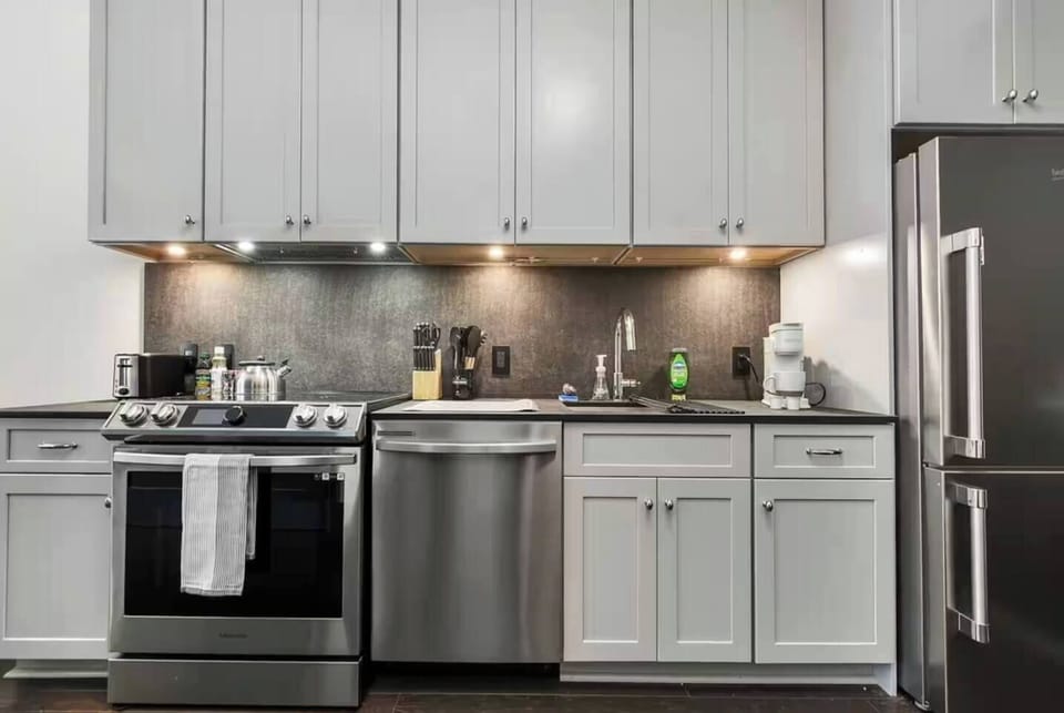 Modern chef-ready kitchen with stainless appliances and sleek finishes