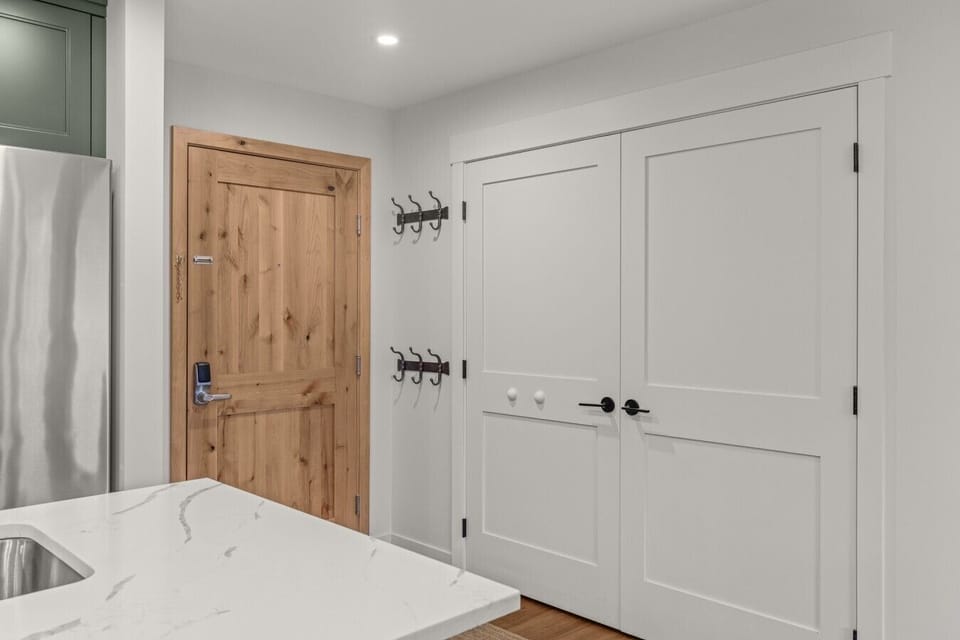 entry-door-keypad-lock-coat-hooks-storage-closet