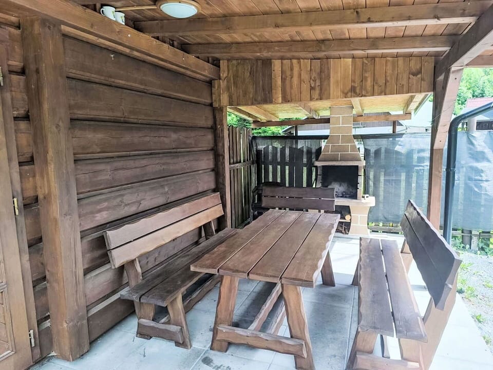 Wood, Hardwood, Plank, Wood Stain, Outdoor Table, Outdoor Structure, Lumber, Shade, Outdoor Furniture, Backyard