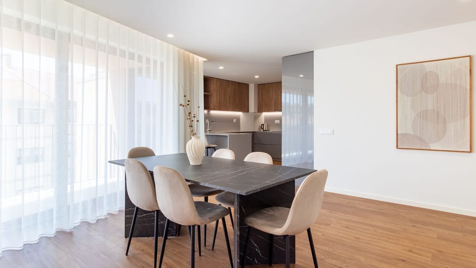 Enjoy the convenience of a modern, well-appointed kitchen flowing effortlessly into the dining space, ideal for preparing and sharing delicious meals with loved ones. Under-cabinet lighting highlights the chic design, ensuring every culinary adventure is 