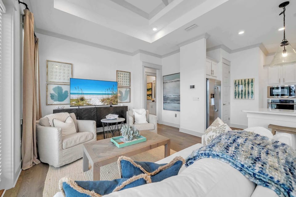 Living room features a sleeper sofa and smart tv