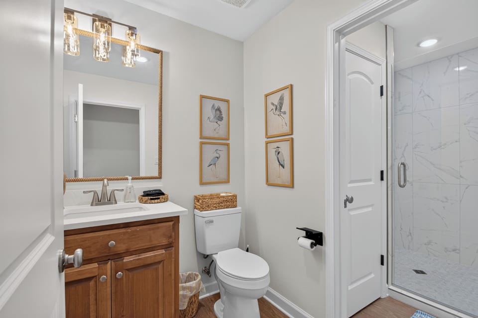 Bright modern bathroom with walk-in glass shower and stylish finishes