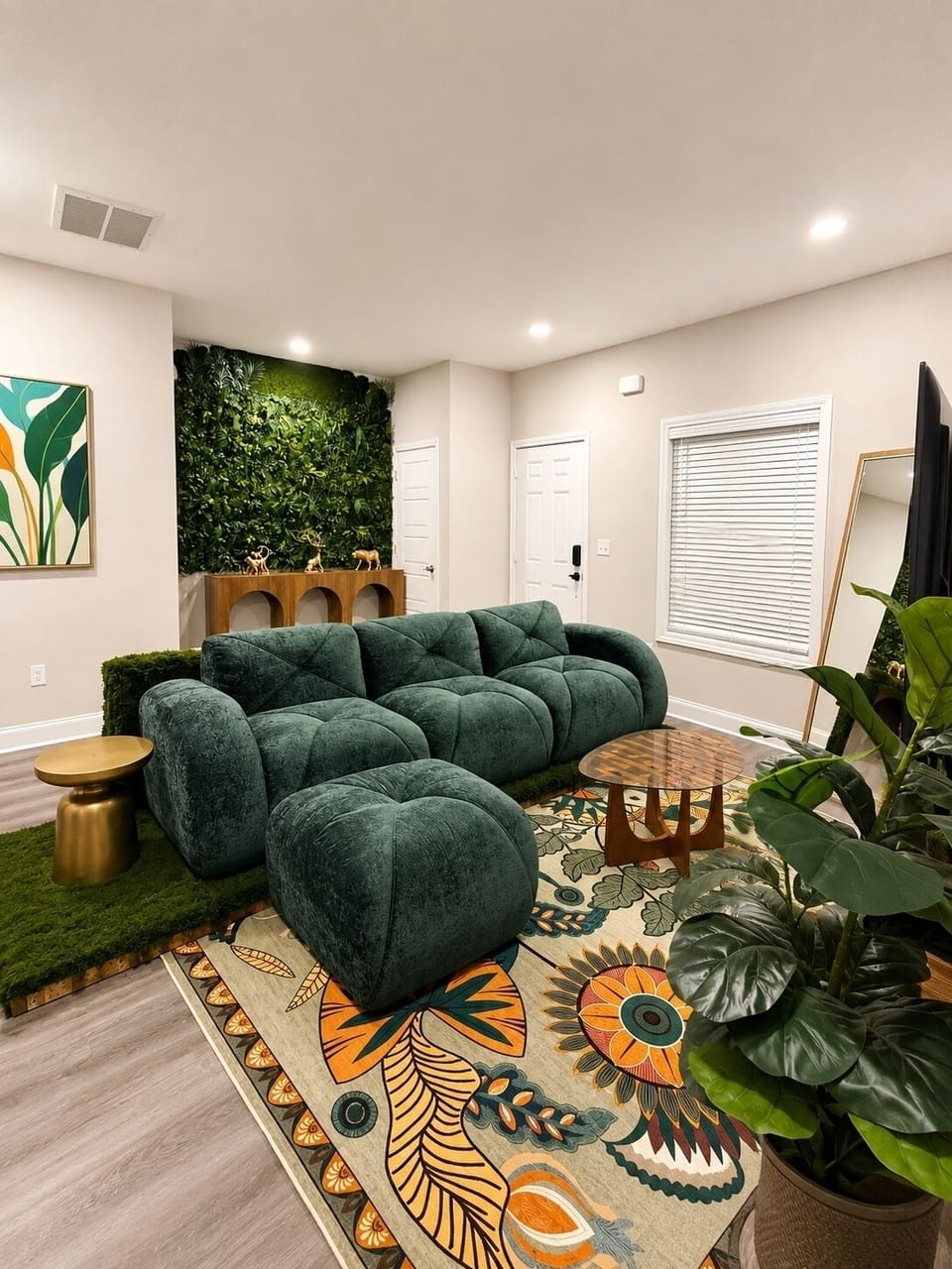 Designer living room with plush sectional and striking green accent wall