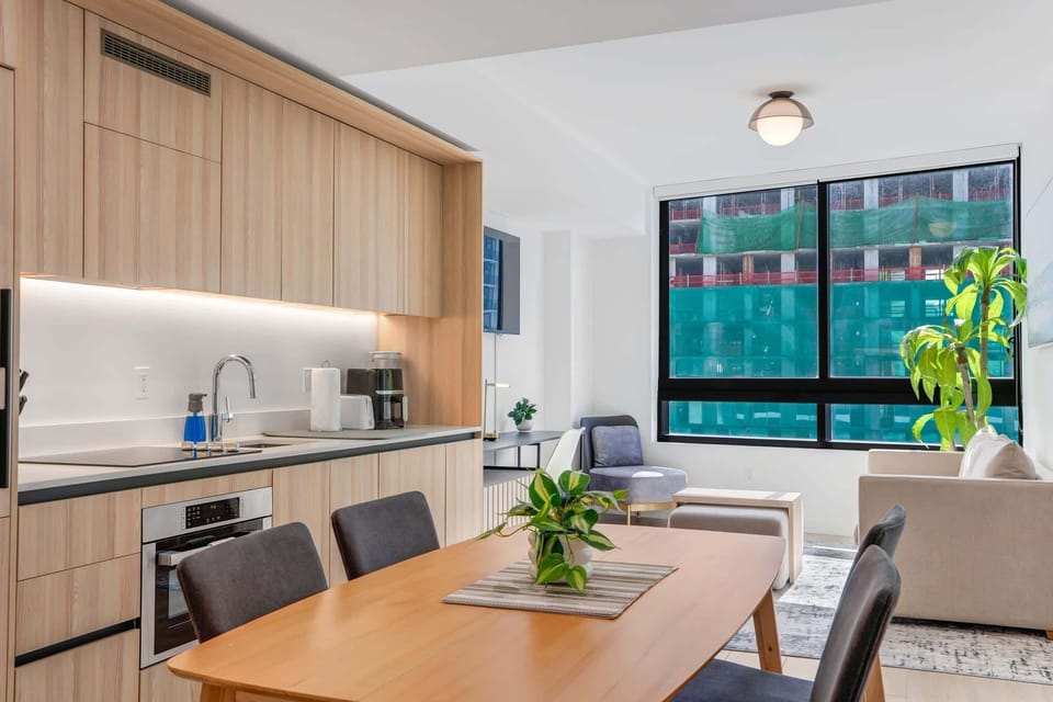 Bright and modern studio with open kitchen and cozy living area, perfect for a relaxing stay.