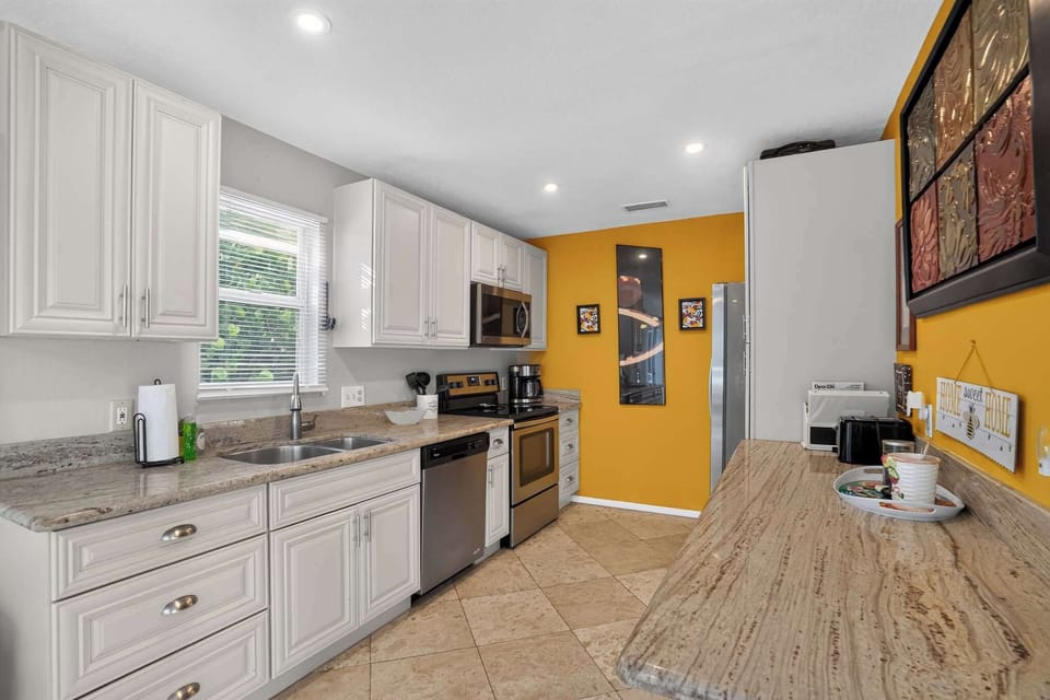 Prepare your favorite meals in the bright, modern kitchen with breakfast seating.