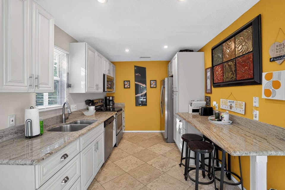 Cook with ease in the fully equipped kitchen featuring generous counter space.