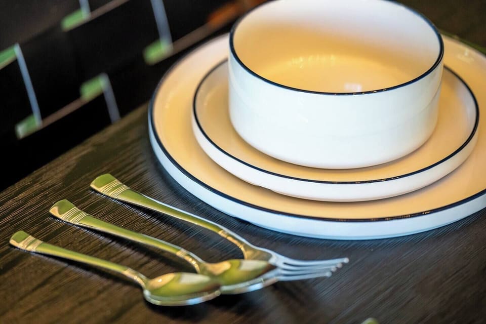 Stylish Table Setting – Modern place settings ready for memorable meals.