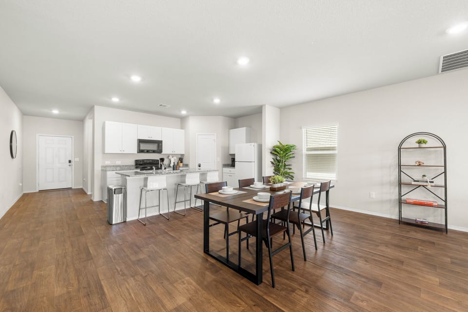 Bright open kitchen & dining with breakfast bar and seating for 6