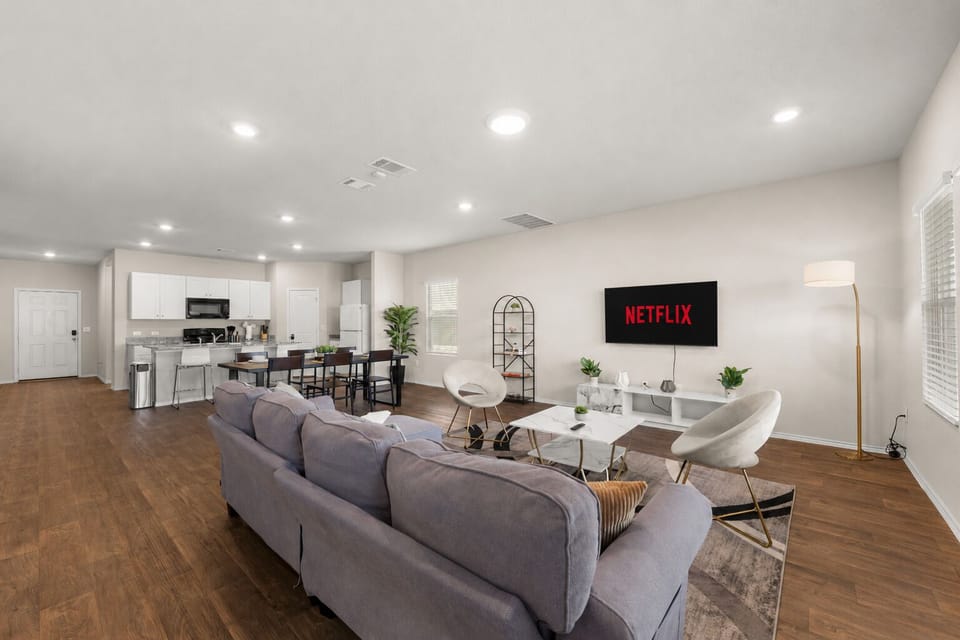 Bright open-plan lounge w/ smart TV, dining for 6 and sleek kitchen