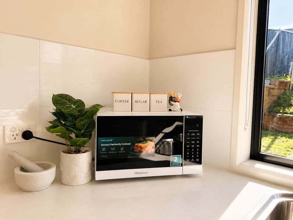 Contemporary kitchen with modern appliances and plenty of preparation space.
