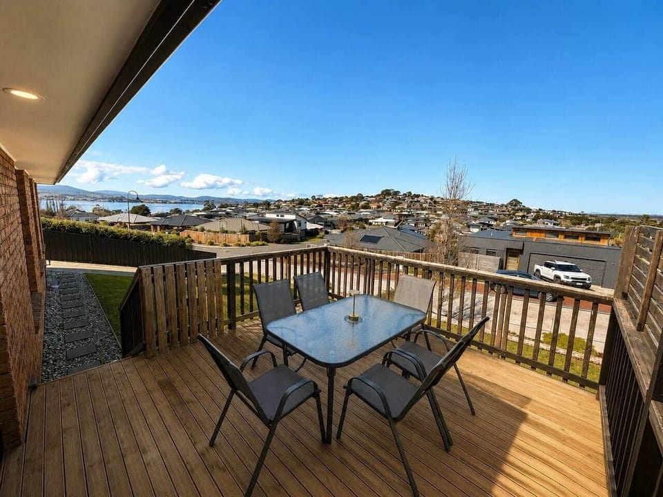 Outdoor deck with beautiful Midway Point water views and alfresco seating.