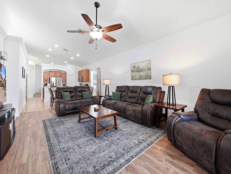 Unwind in the inviting living room with comfortable seating and a Smart TV
