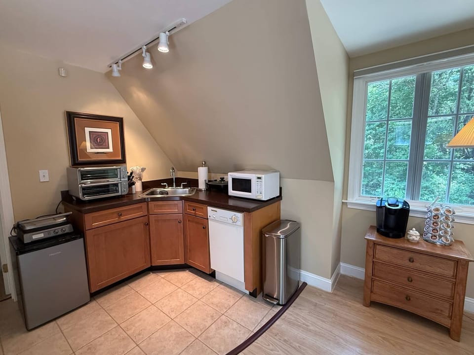 Our kitchenette comes stocked with everything needed for cooking, including a microwave, Ninja double oven, electric skillet and hot plate, as well as plenty of cutlery and crockery. We also have a minifridge, dishwasher, and Keurig.