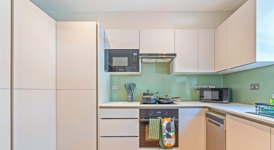 Contemporary kitchen with modern appliances and generous workspace.