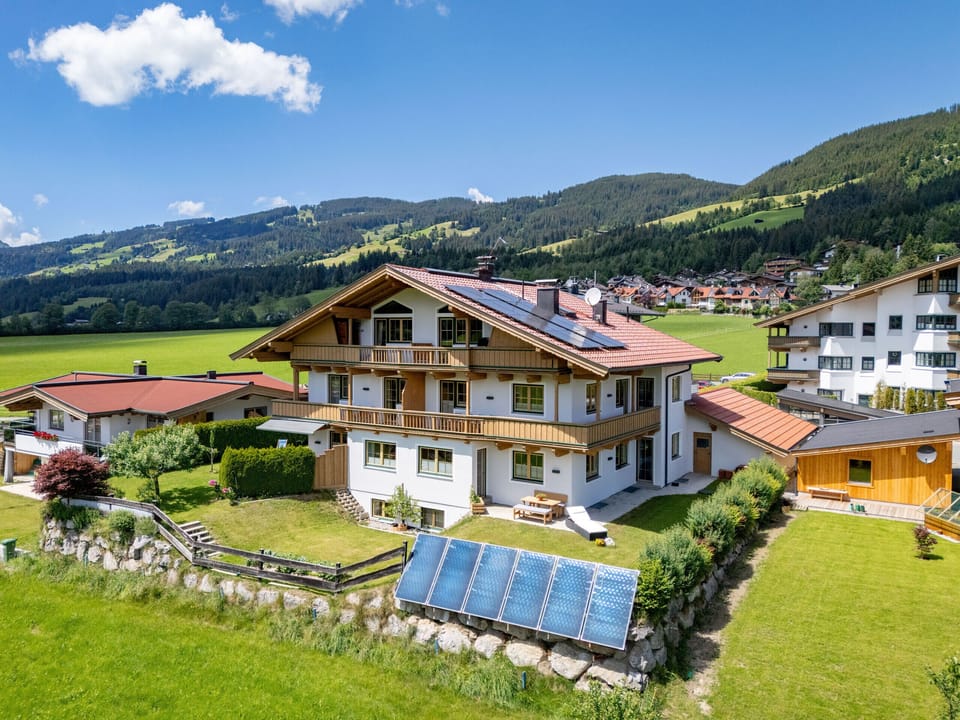 Kirchberg in Tirol vacation rental with balcony, garage, parking and peaceful surroundings with views toward Sonnberg.