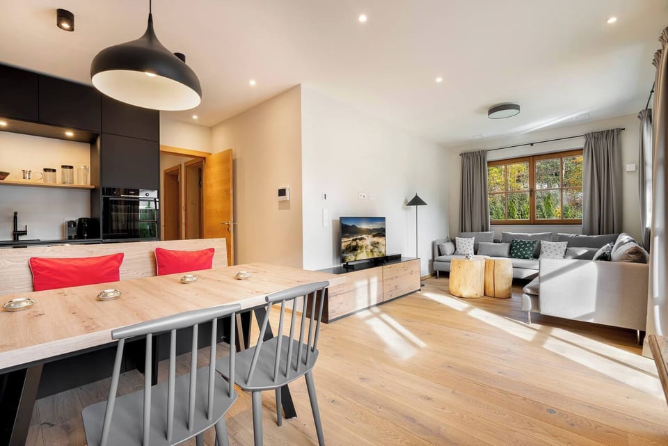 Modern kitchen with open living room in Kirchberg, ideal for self-catering, family vacations, ski trips and longer stays in Tyrol.