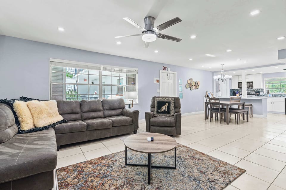 Spacious living room with comfortable seating and Smart TV.