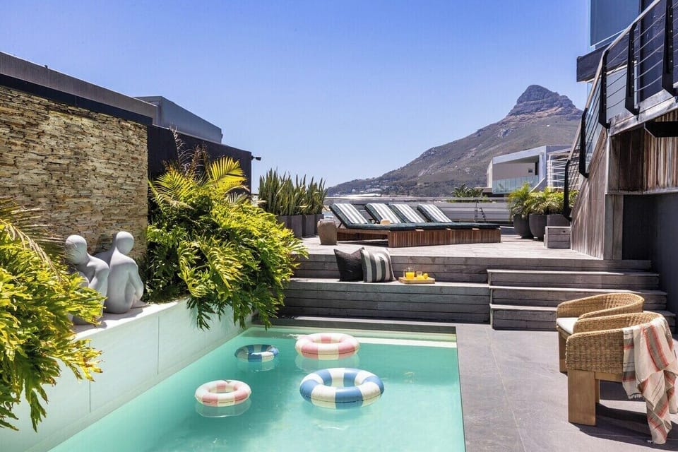 Drift between poolside lounging and ocean gazing