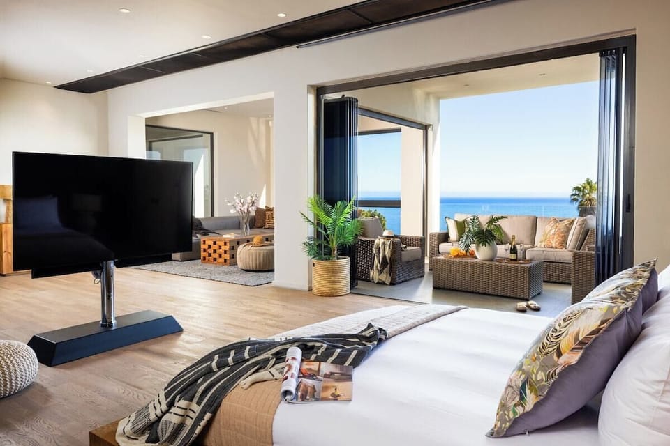 Bedroom One 
●	King size bed 
●	Private sitting area/lounge
●	TV with Media Box
●	Glass sliding doors leading to a terrace with outdoor furniture and ocean views
●	En suite bathroom 
●	Walk-in closet
●	Air-conditioning/ heater
