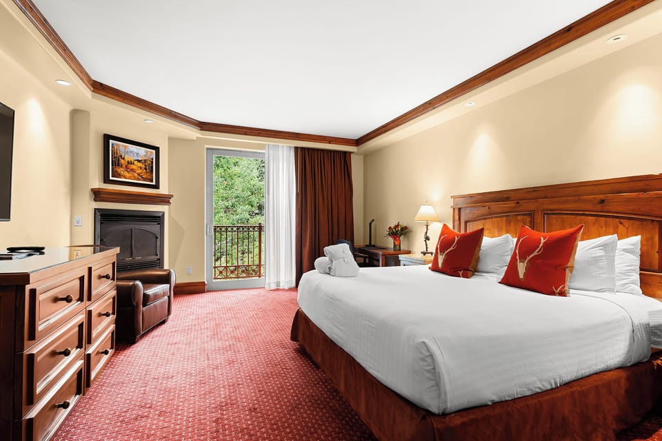 Unwind in a plush king bed with balcony breezes.