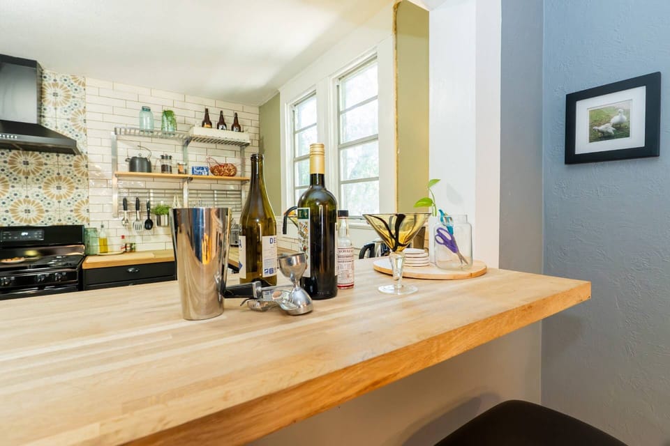 The pass-through keeps the kitchen connected to the dining room for an open, social feel.