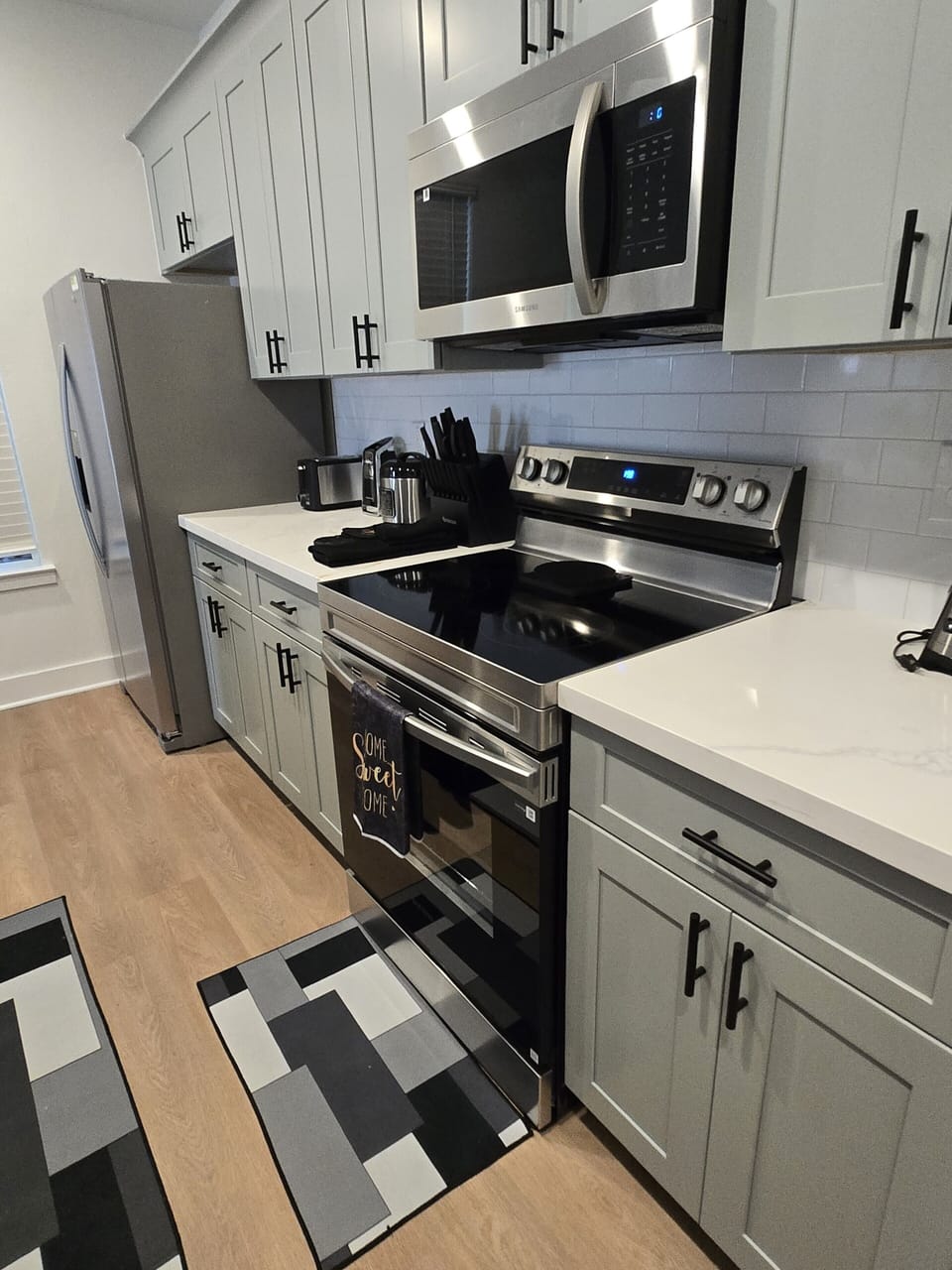 Modern kitchen with stainless appliances and bright, stylish finishes