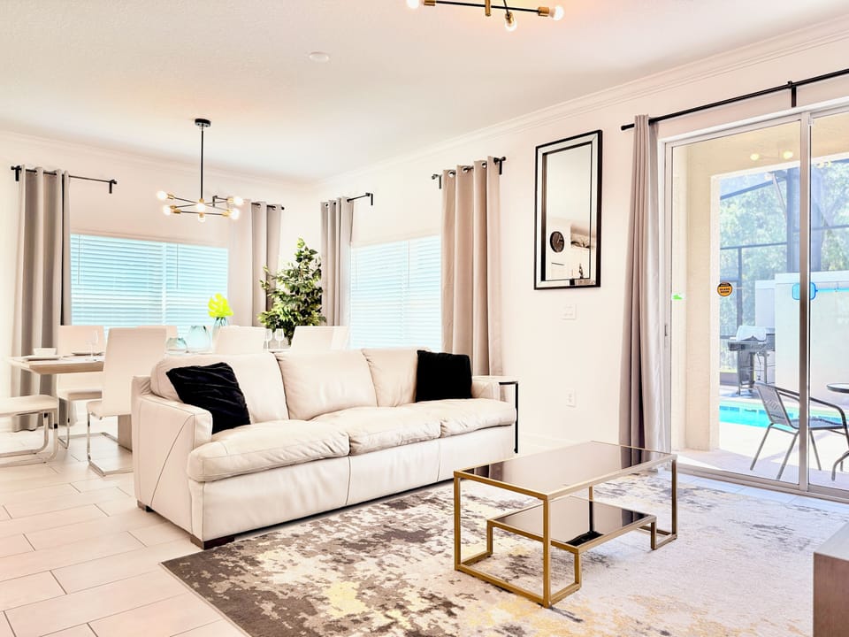 Open floor plan lounge with plush seating and gold coffee table.